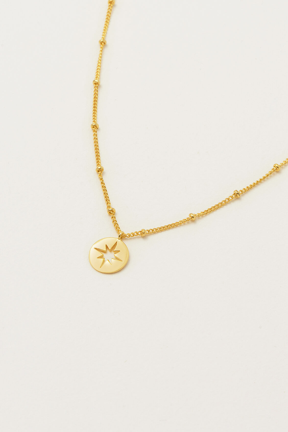 Estella Bartlett Starburst Disc Necklace