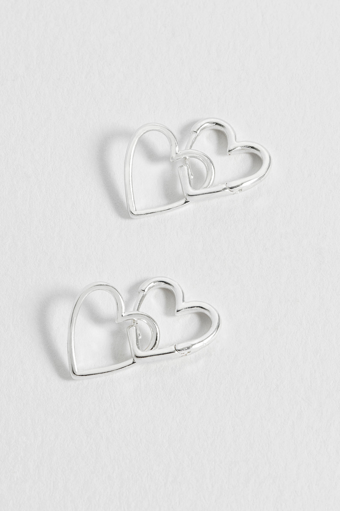 Estella Bartlett Double Heart Hinged Hoop Earrings Silver